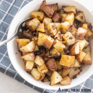 onion soup mix potatoes in serving bowl with spoon