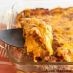 venison casserole recipe shown with a serving spoon lifting up a serving