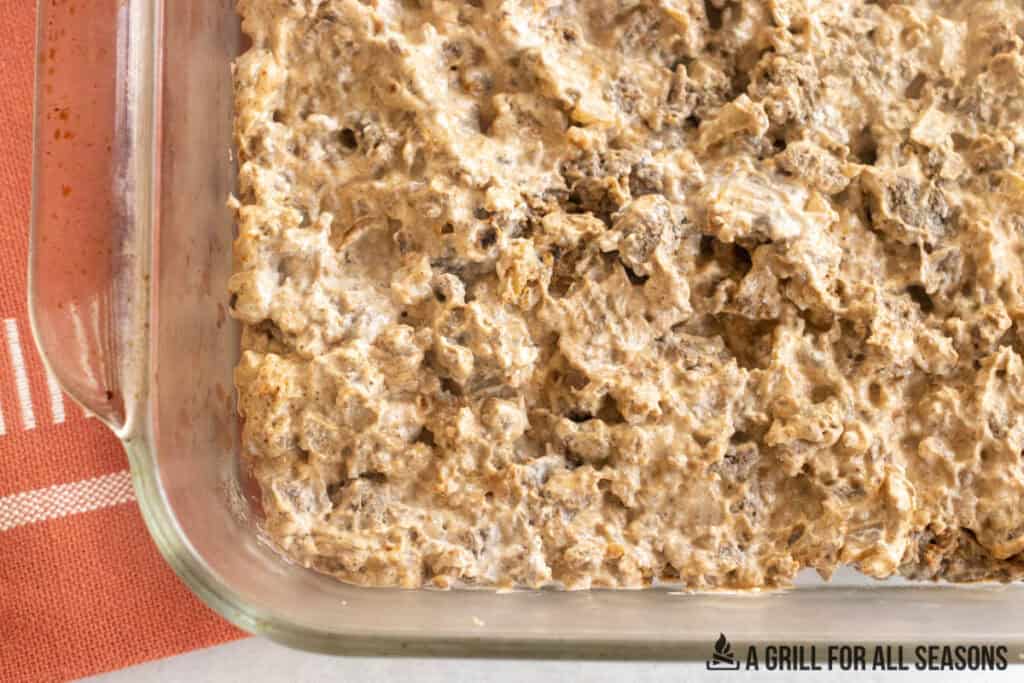 creamy ground venison mixture in baking dish