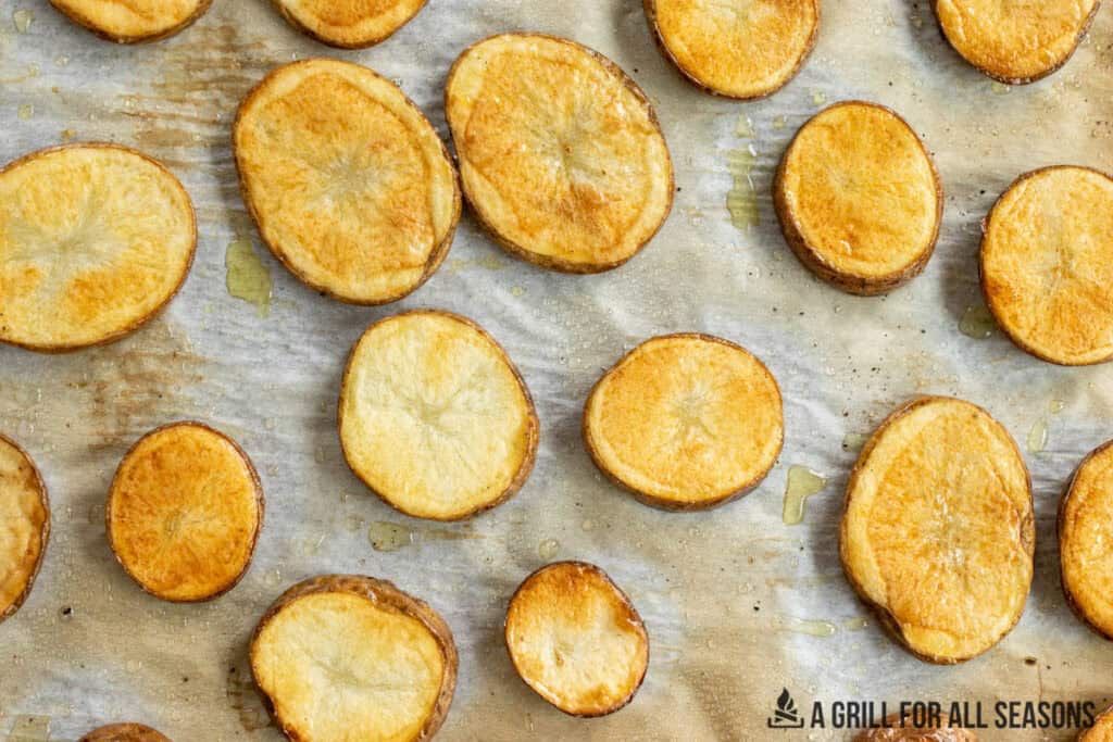 slices of roasted potato on baking tray