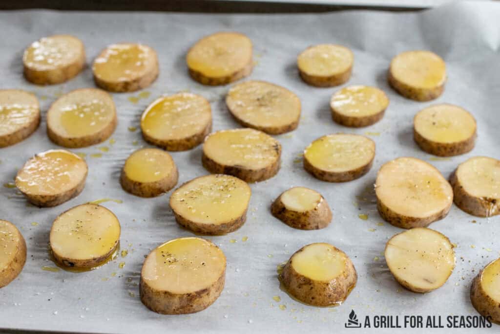 raw potato slices on parchment