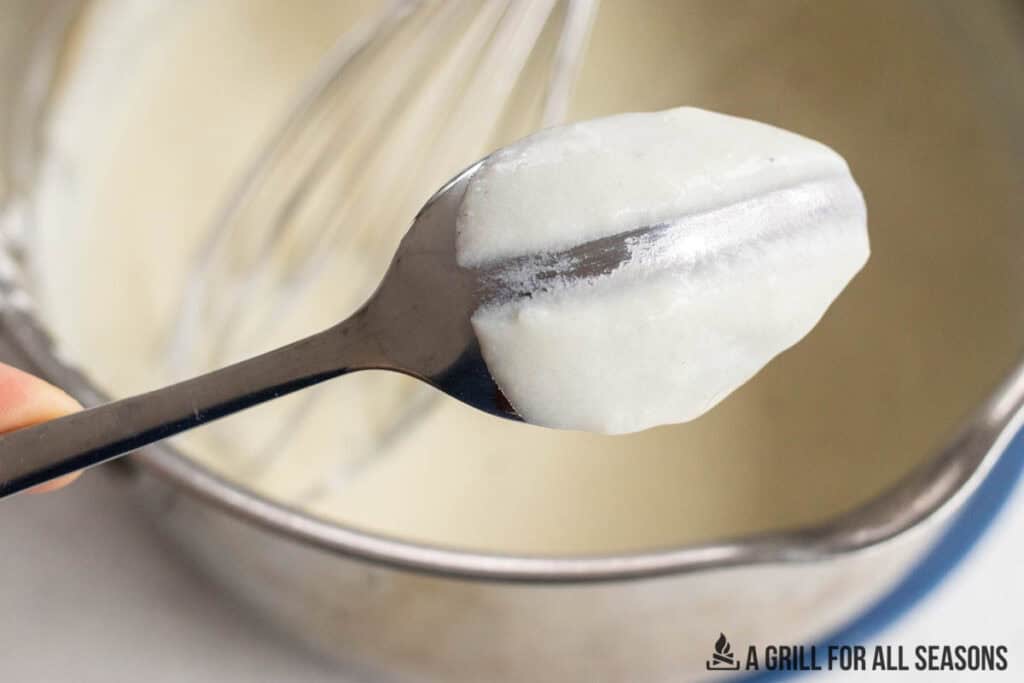 thickened sauce on spoon