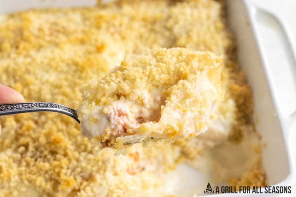 spoon lifting up a baked shell