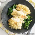 salmon stuffed shells recipe close up on dinner bed on bed of spinach