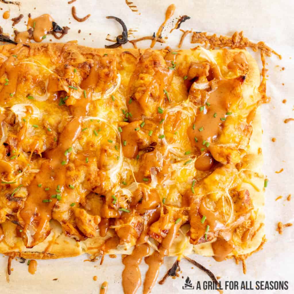 bbq chicken flatbread recipe close up on parchment from overhead