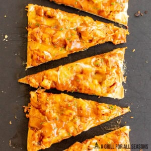 bbq chicken flatbread recipe cut into slices on cutting board