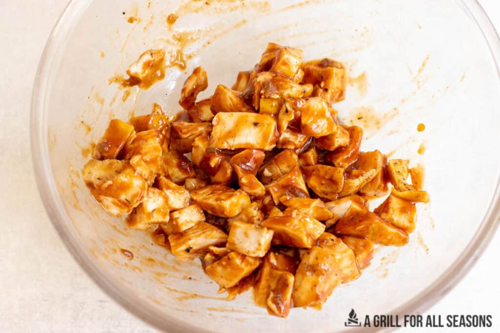bowl with chopped chicken in bbq sauce