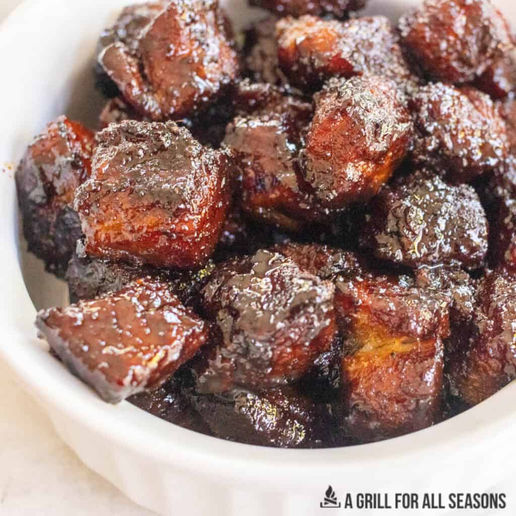 candied pork belly close up in bowl