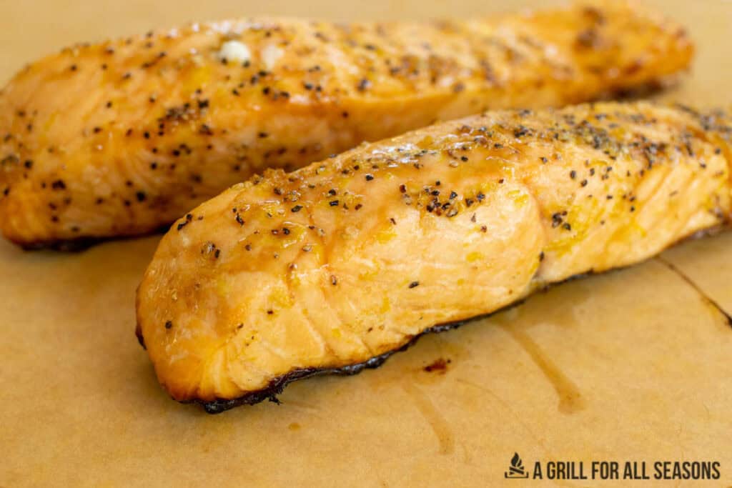 salmon filets resting on cutting board close up