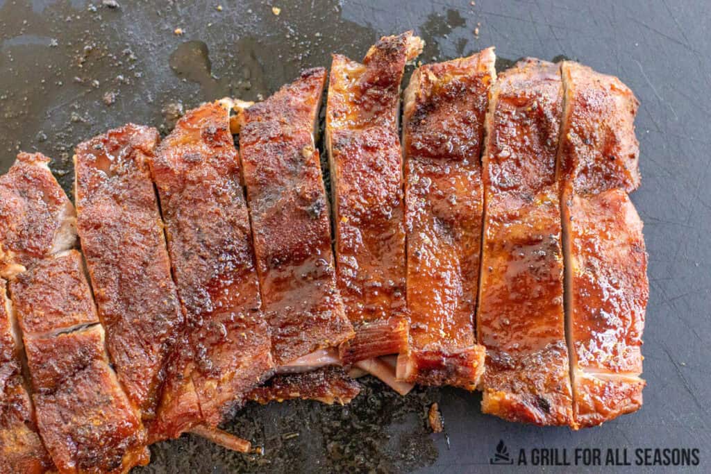 pork belly steak cut into strips on cutting board