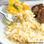 cheesy breakfast potatoes on a fork