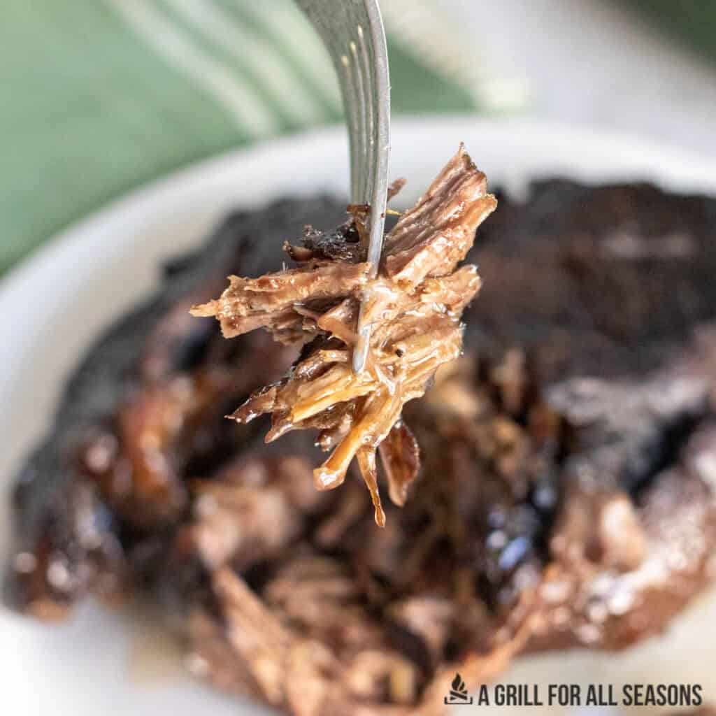 fork with bite of braised beef roast