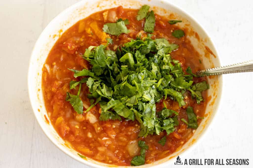 cilantro added to bowl