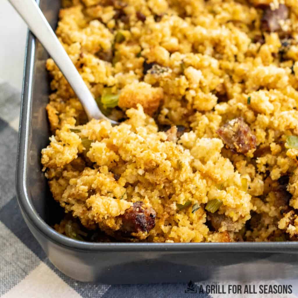close up of smoked sausage stuffing in baking dish