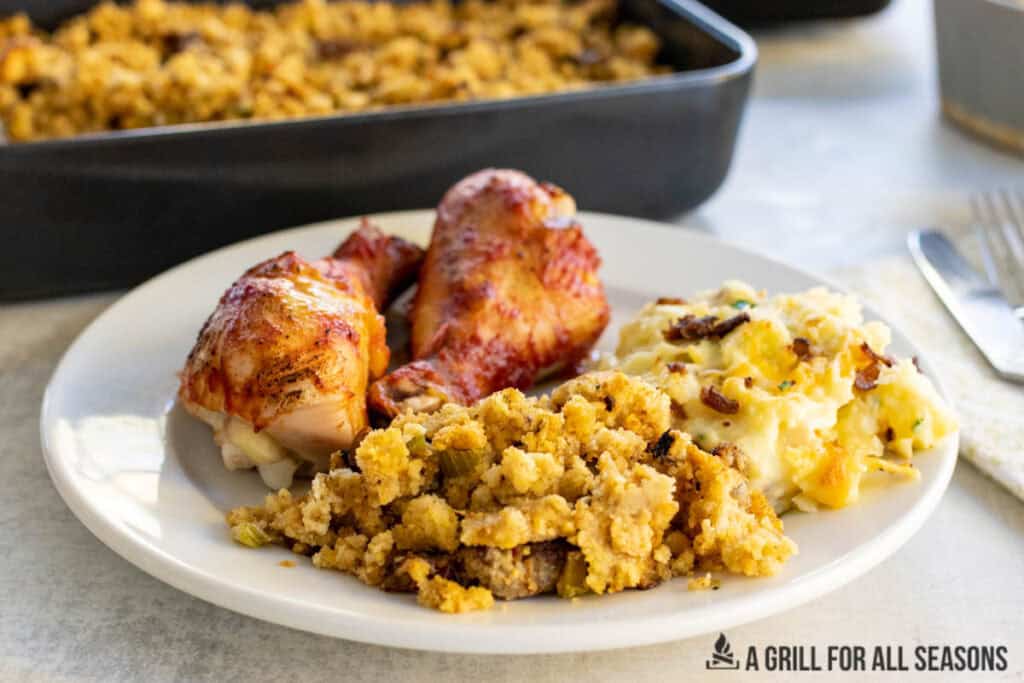 smoked stuffing plated with chicken legs and mashed potatoes