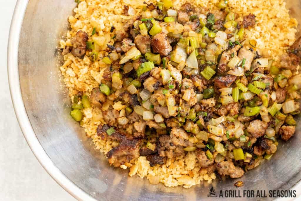 sausage and vegetables added to bowl